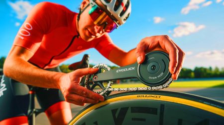 Illustration of a cyclist installing the CycleClick power meter on a bicycle chain.