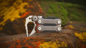 Illustration of the SwitchDisc multitool with its swappable cores and titanium main body.