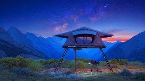 Experience ‘Camping Redefined’ as Wild Land Sky Rover’s Clear Rooftop Tent Packs Its Own Toilet for Ultimate Comfort Illustration of the Sky Rover rooftop tent with its transparent roof and automated lift system.